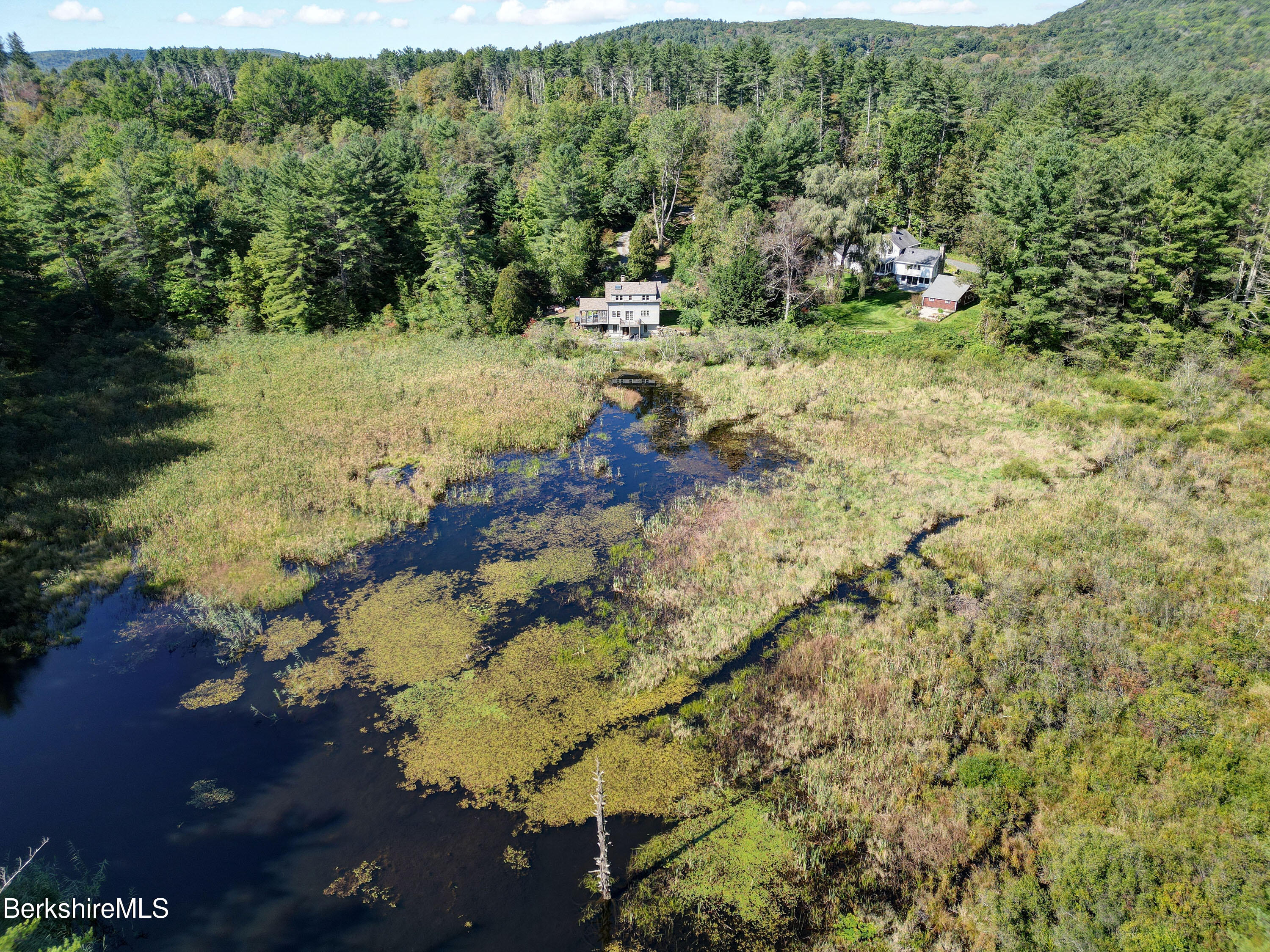 56 Brett Road Monterey, MA 01245 - Photo 20 of 22 a view of a yard with wooden fence