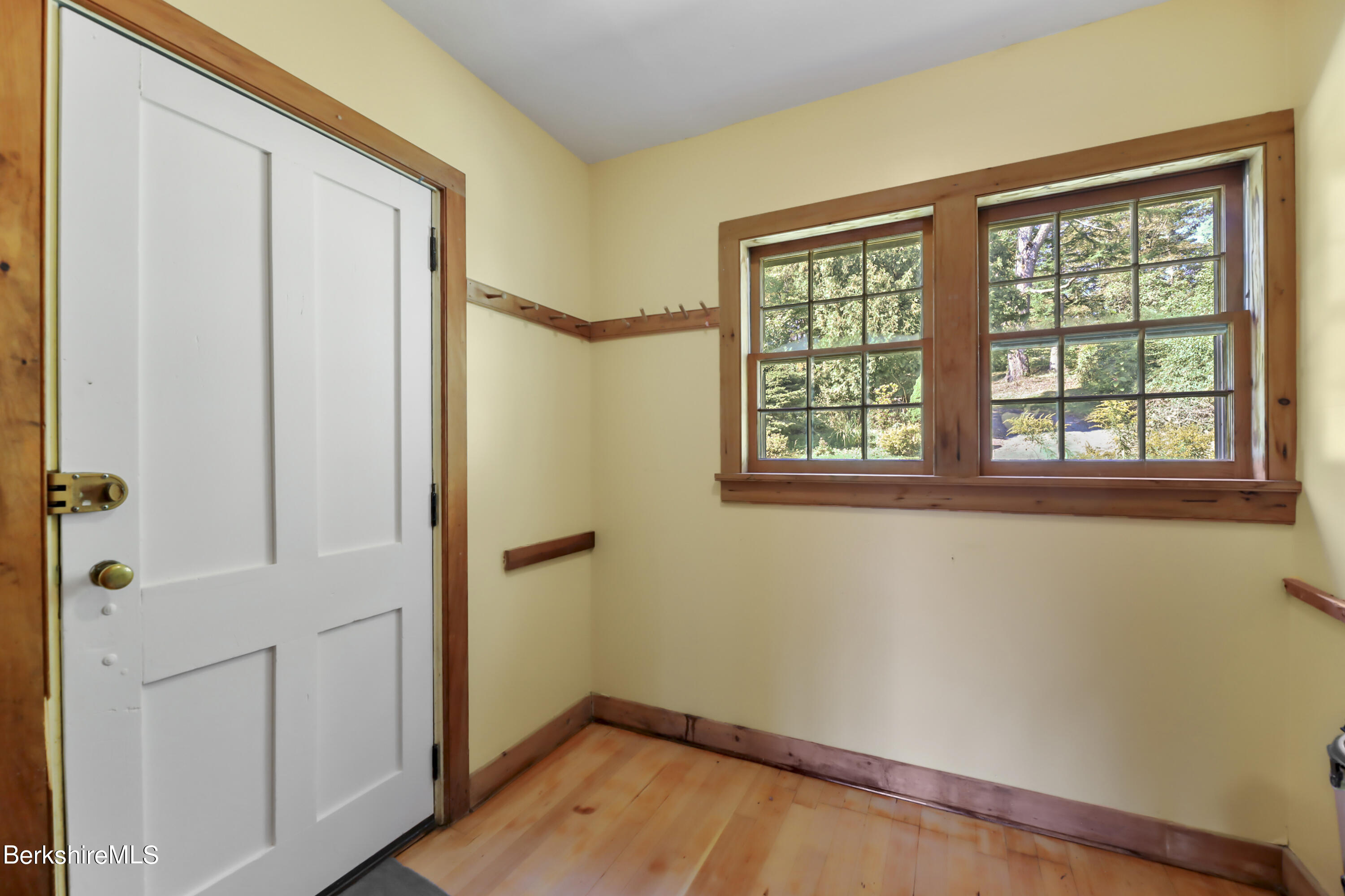 56 Brett Road Monterey, MA 01245 - Photo 5 of 22 an empty room with wooden floor and windows