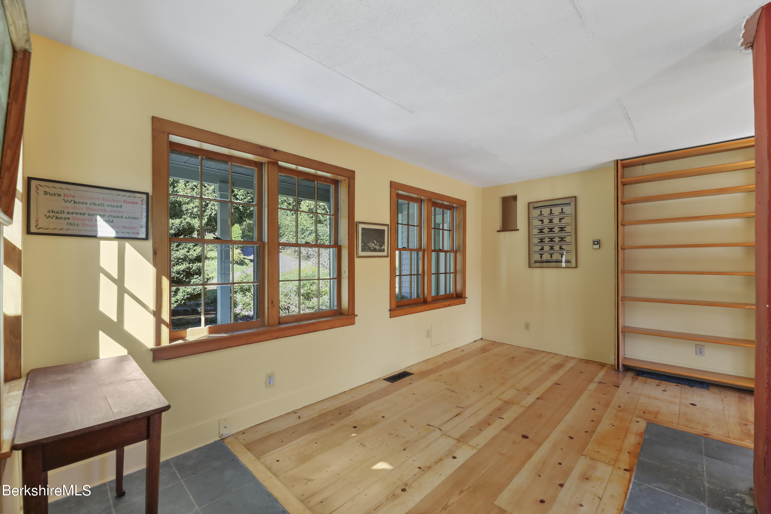 56 Brett Road Monterey, MA 01245 - Photo 9 of 22 a view of an empty room with a window and wooden floor