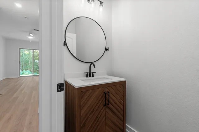 a bathroom with a sink and a mirror