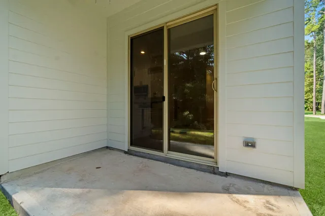 a view of a glass door and a window