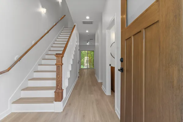 a view of a hallway with staircase