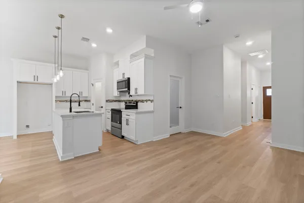 a view of kitchen with wooden floor