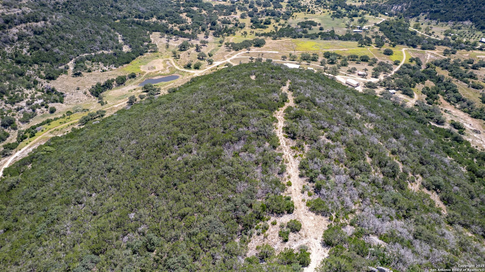 2242 Patterson Creek Road Leakey, TX 78873 - Photo 11 of 57 an aerial view of a houses with yard