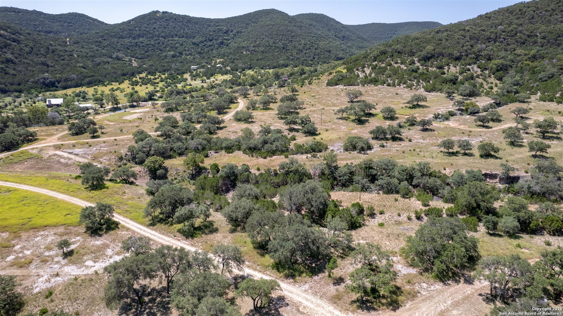 2242 Patterson Creek Road Leakey, TX 78873 - Photo 14 of 57 a view of a large body of water with a mountain in the background