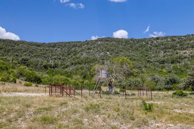 a view of a house with a wooden deck