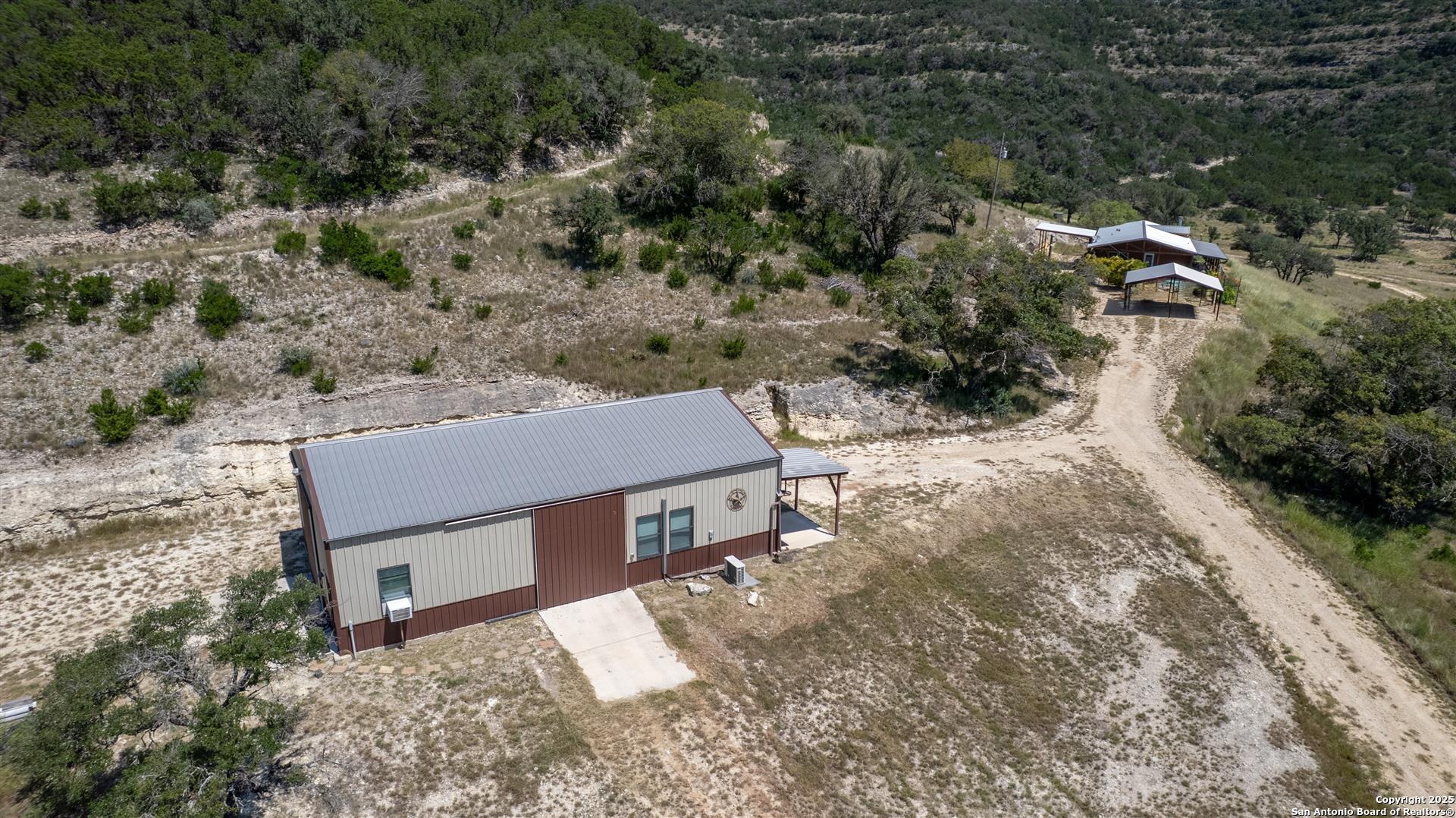 2242 Patterson Creek Road Leakey, TX 78873 - Photo 22 of 57 an aerial view of a house with a yard