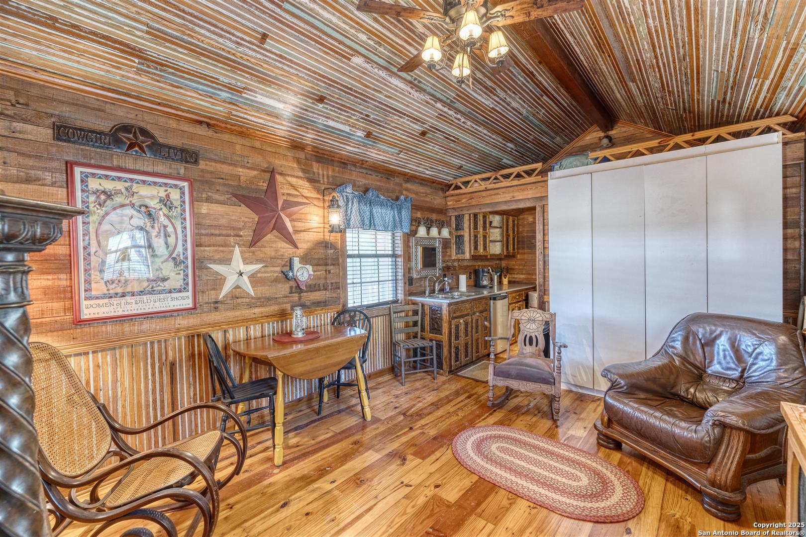 2242 Patterson Creek Road Leakey, TX 78873 - Photo 35 of 57 a outdoor space with lots of chairs and a chandelier