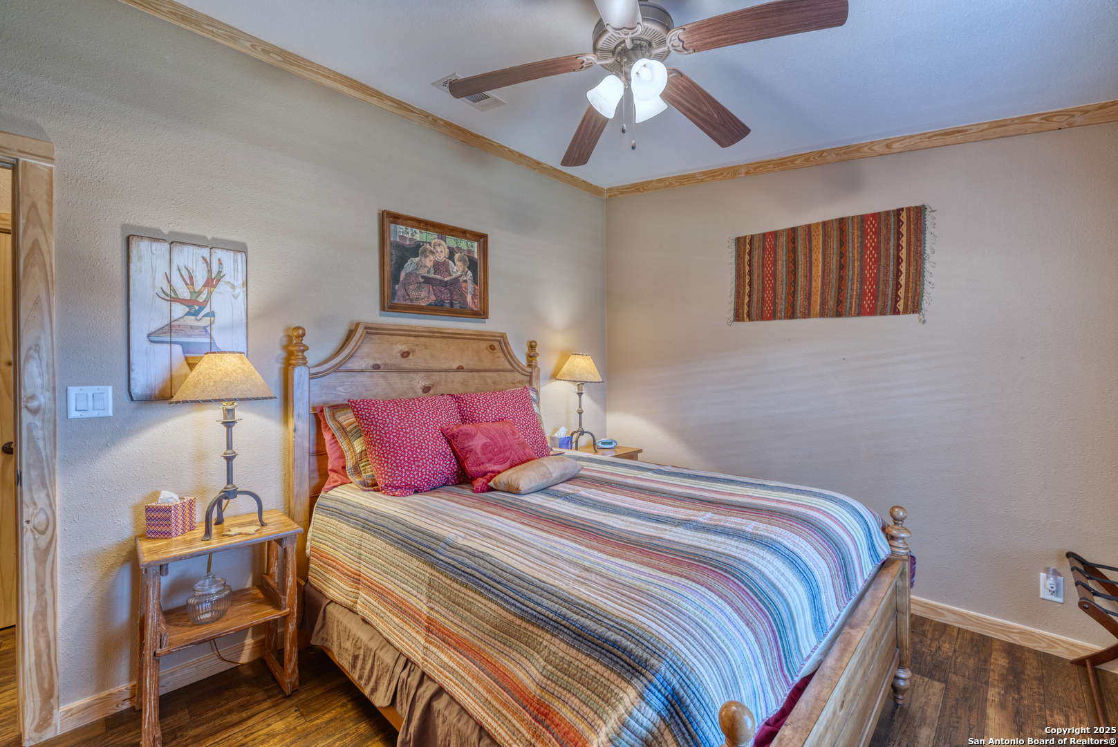 2242 Patterson Creek Road Leakey, TX 78873 - Photo 50 of 57 a bedroom with a bed and a chandelier