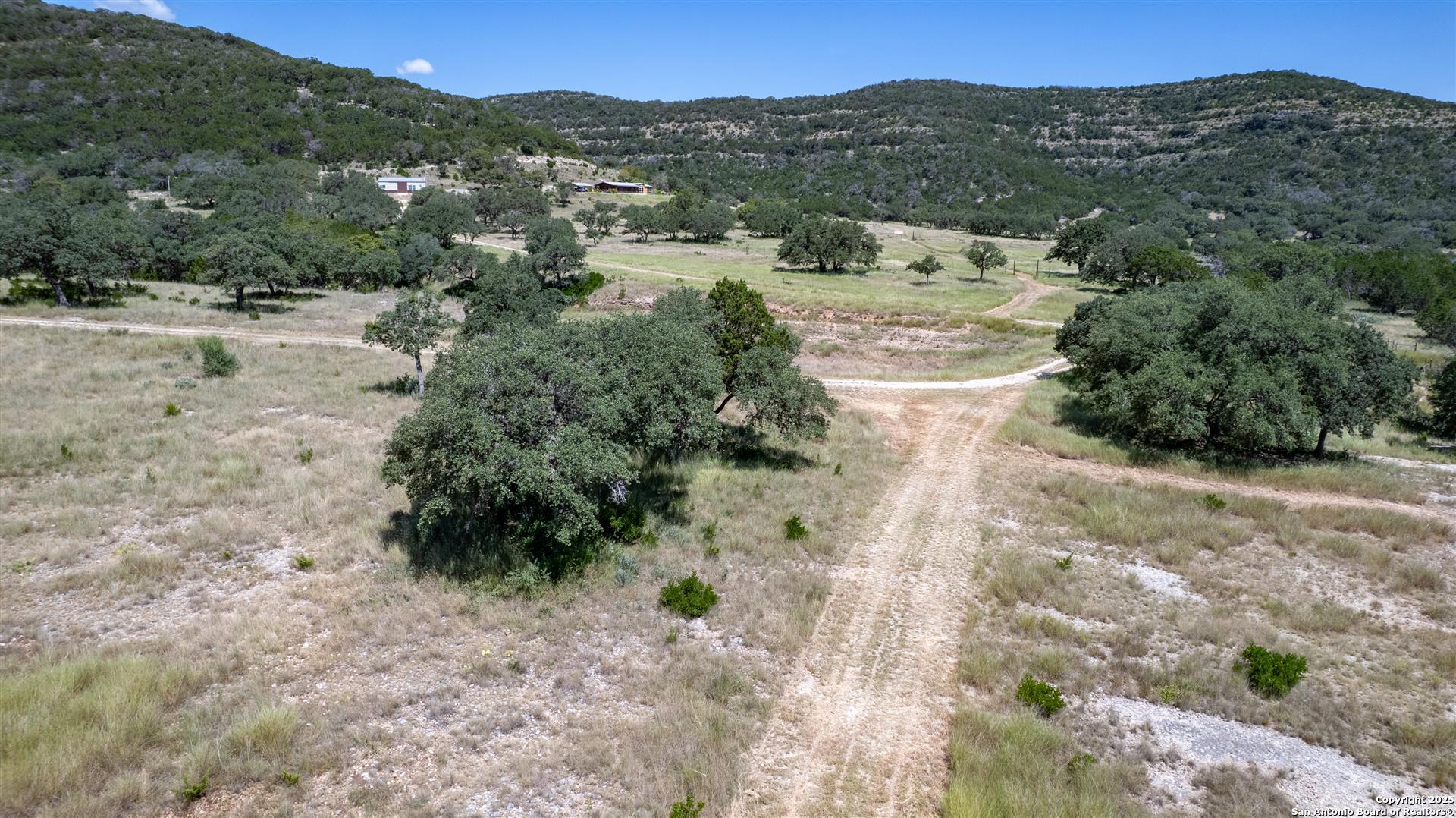 2242 Patterson Creek Road Leakey, TX 78873 - Photo 5 of 57 a view of a yard with a mountain
