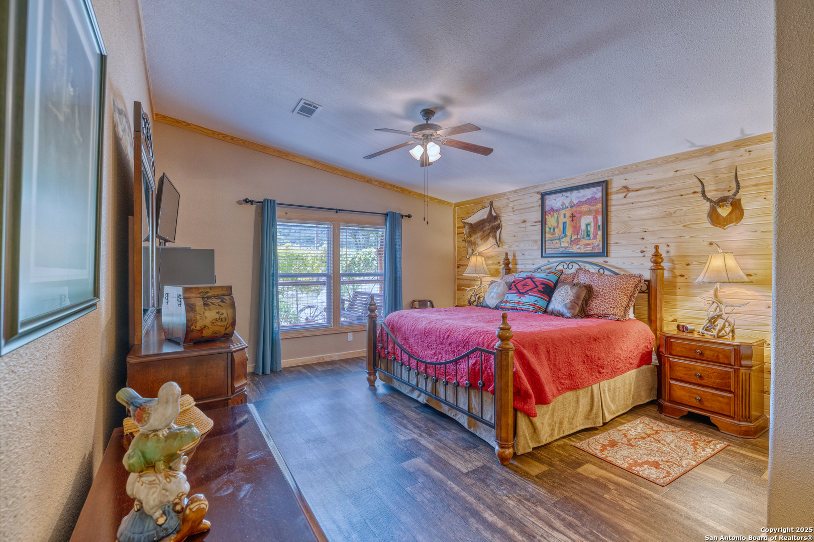 2242 Patterson Creek Road Leakey, TX 78873 - Photo 53 of 57 a bedroom with a bed and wooden floor