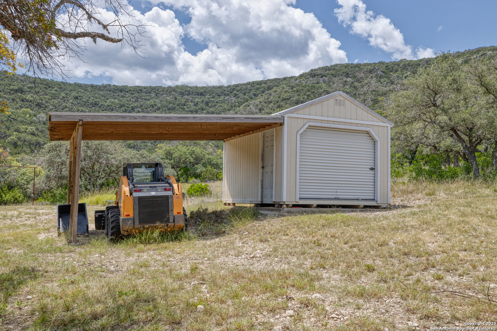 2242 Patterson Creek Road Leakey, TX 78873 - Photo 55 of 57 a view of a house with a yard