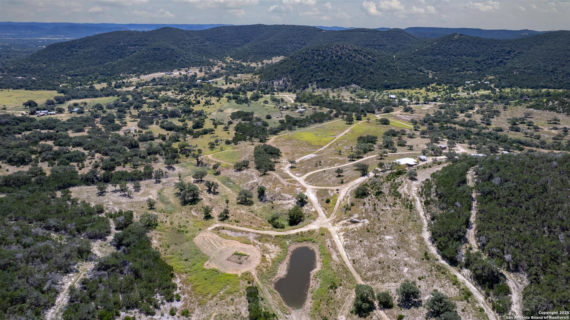 2242 Patterson Creek Road Leakey, TX 78873 - Photo 6 of 57 an aerial view of residential house and sandy dunes