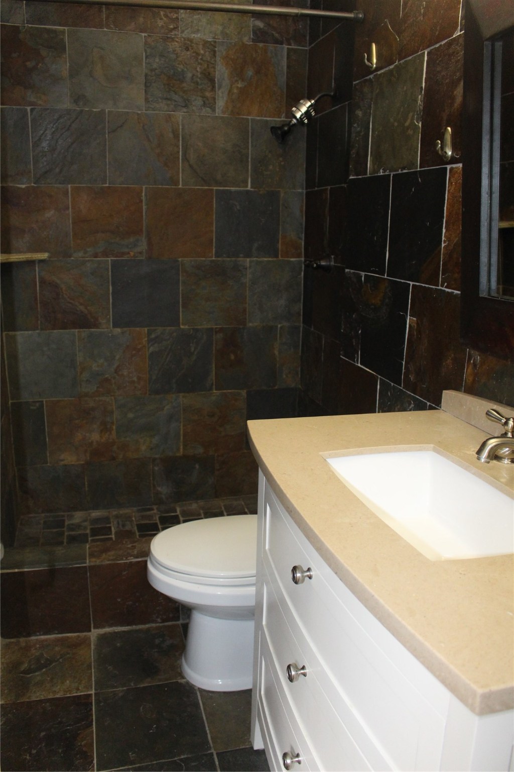 8277 Kingsbrook Road, Unit 255 Houston, TX 77024 - Photo 14 of 27 a bathroom with a sink toilet vanity and shower