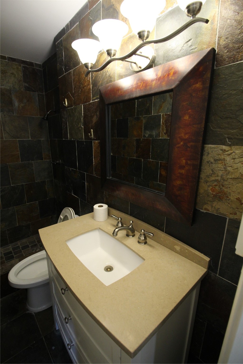 8277 Kingsbrook Road, Unit 255 Houston, TX 77024 - Photo 15 of 27 a bathroom with a sink a toilet and shower