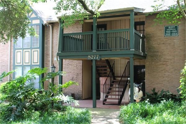 8277 Kingsbrook Road, Unit 255 Houston, TX 77024 - Photo 25 of 27 front view of a house with an outdoor space