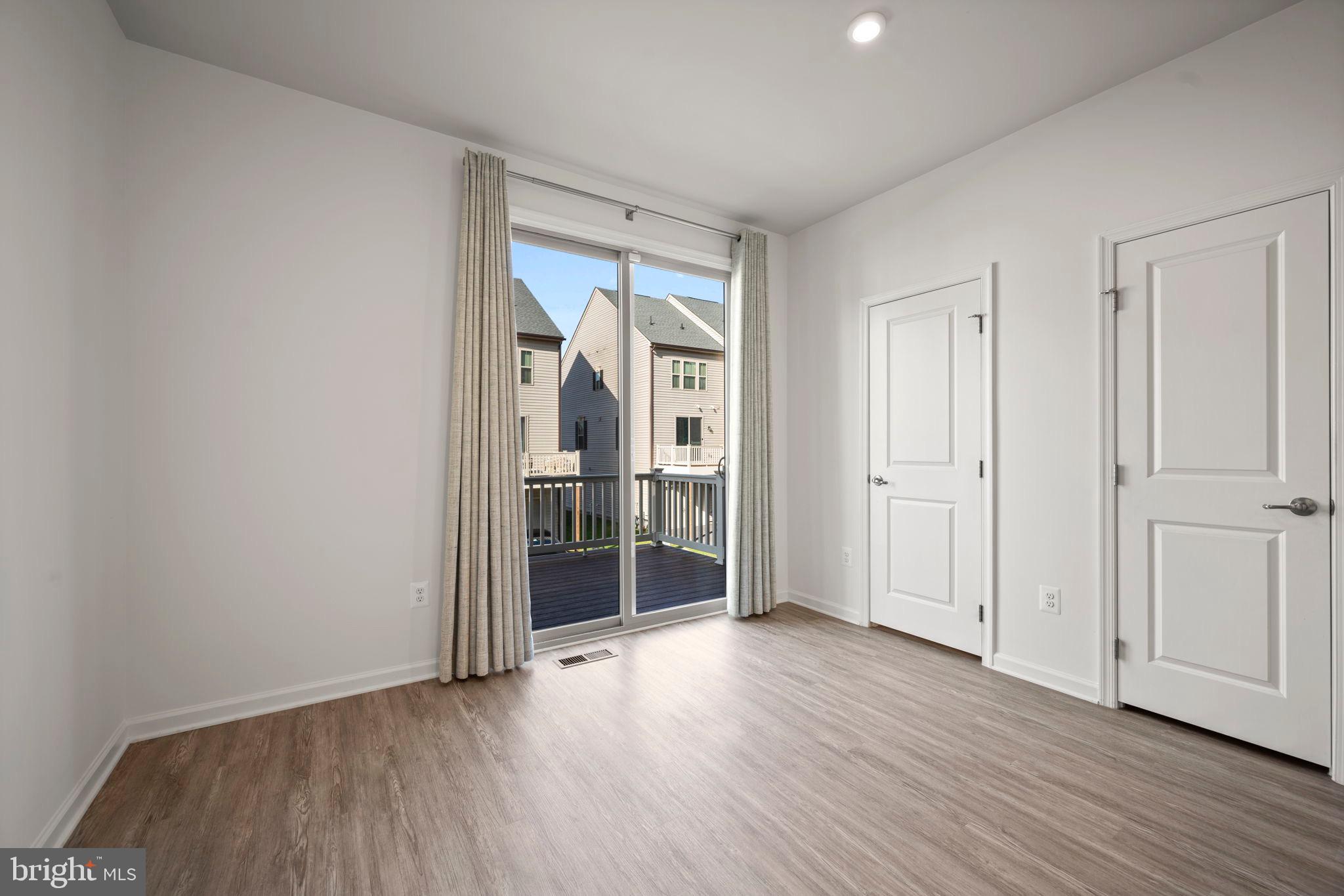 3769 Cedar Mountain Way Hanover, MD 21076 - Photo 14 of 52 a view of empty room with wooden floor