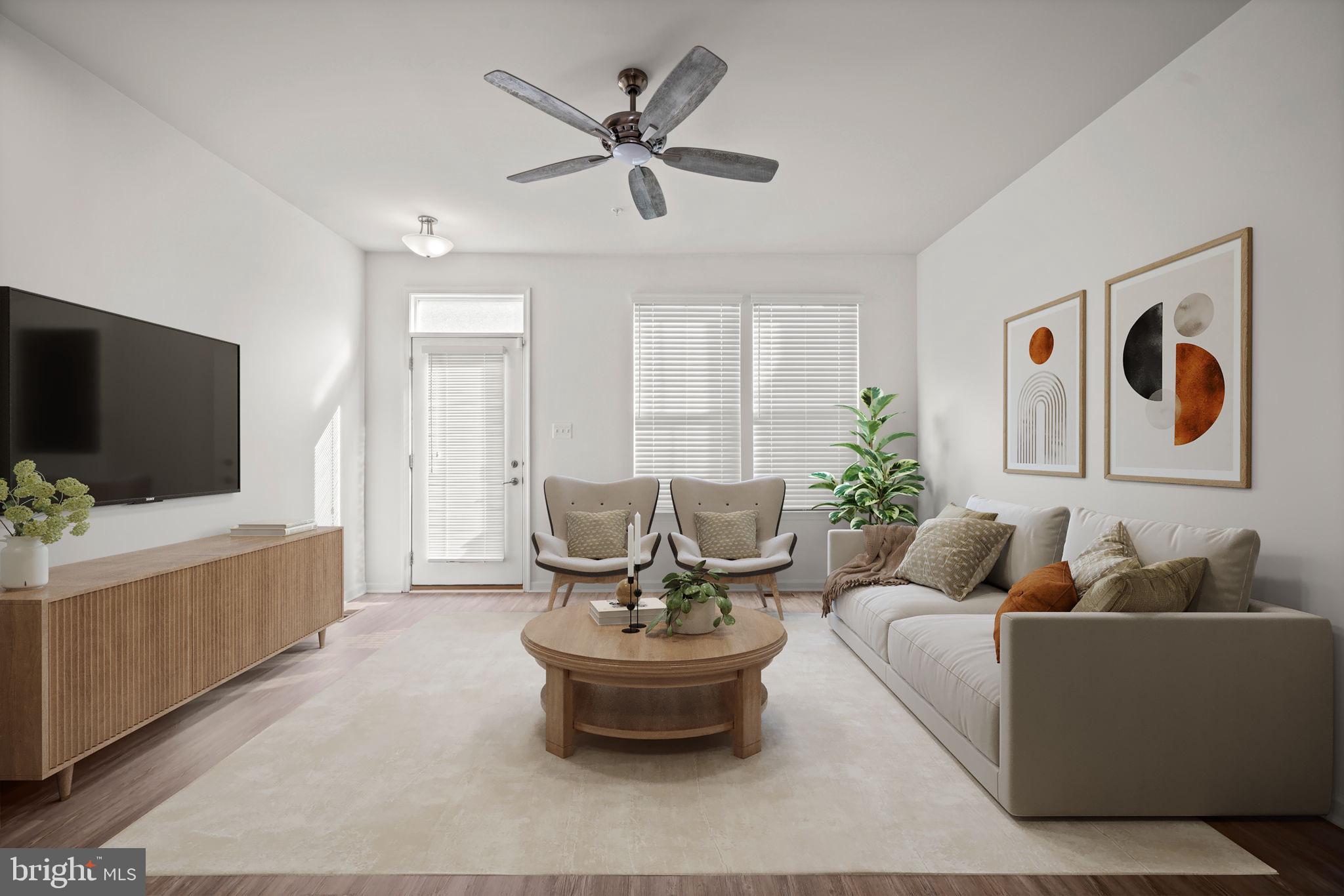 3769 Cedar Mountain Way Hanover, MD 21076 - Photo 2 of 52 a living room with furniture and a flat screen tv