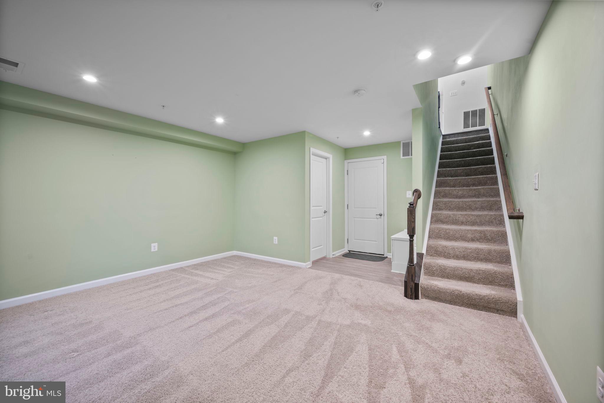 3769 Cedar Mountain Way Hanover, MD 21076 - Photo 20 of 52 a view of an empty room with stairs