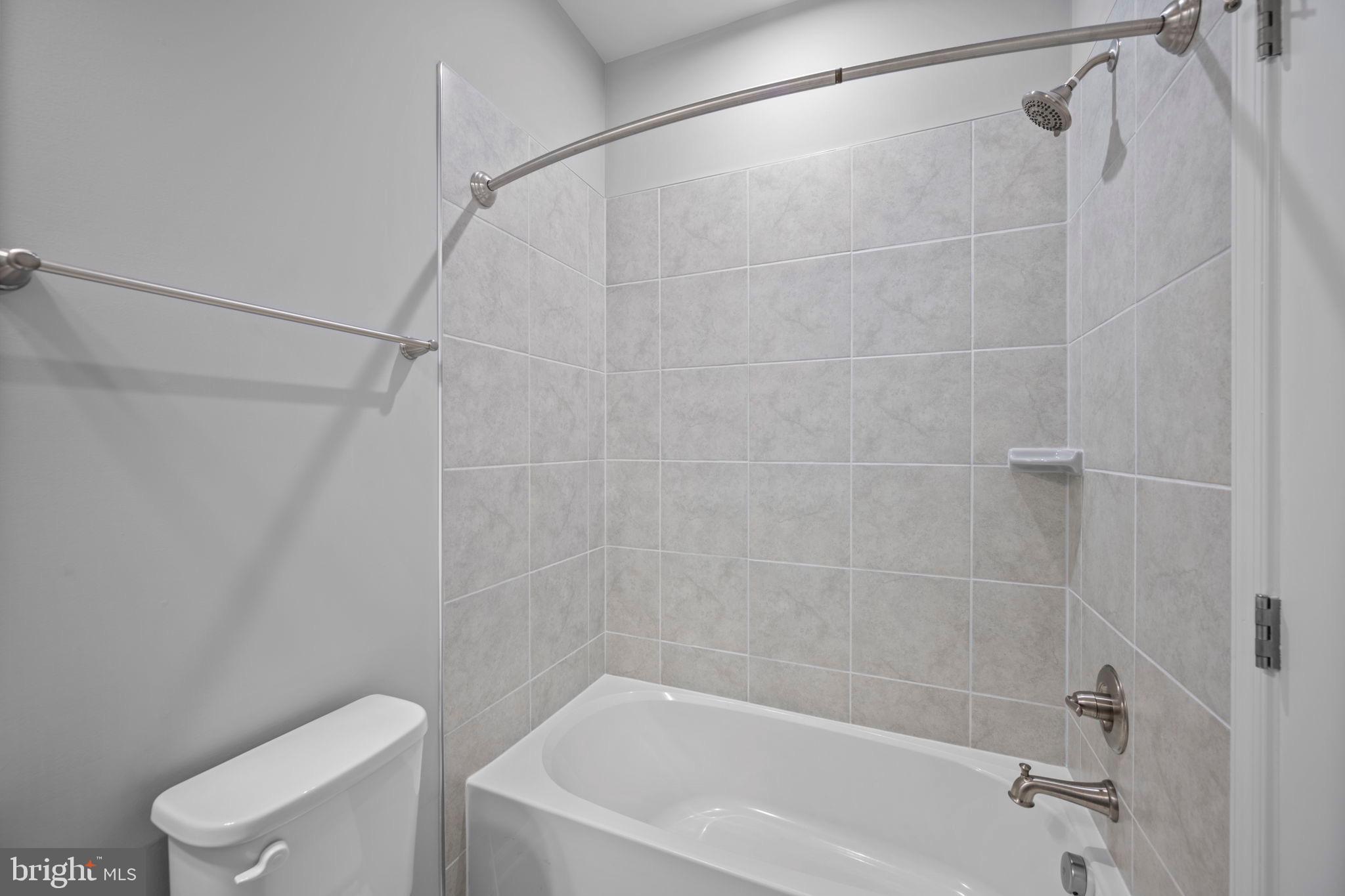 3769 Cedar Mountain Way Hanover, MD 21076 - Photo 35 of 52 a bathroom with a shower and a toilet