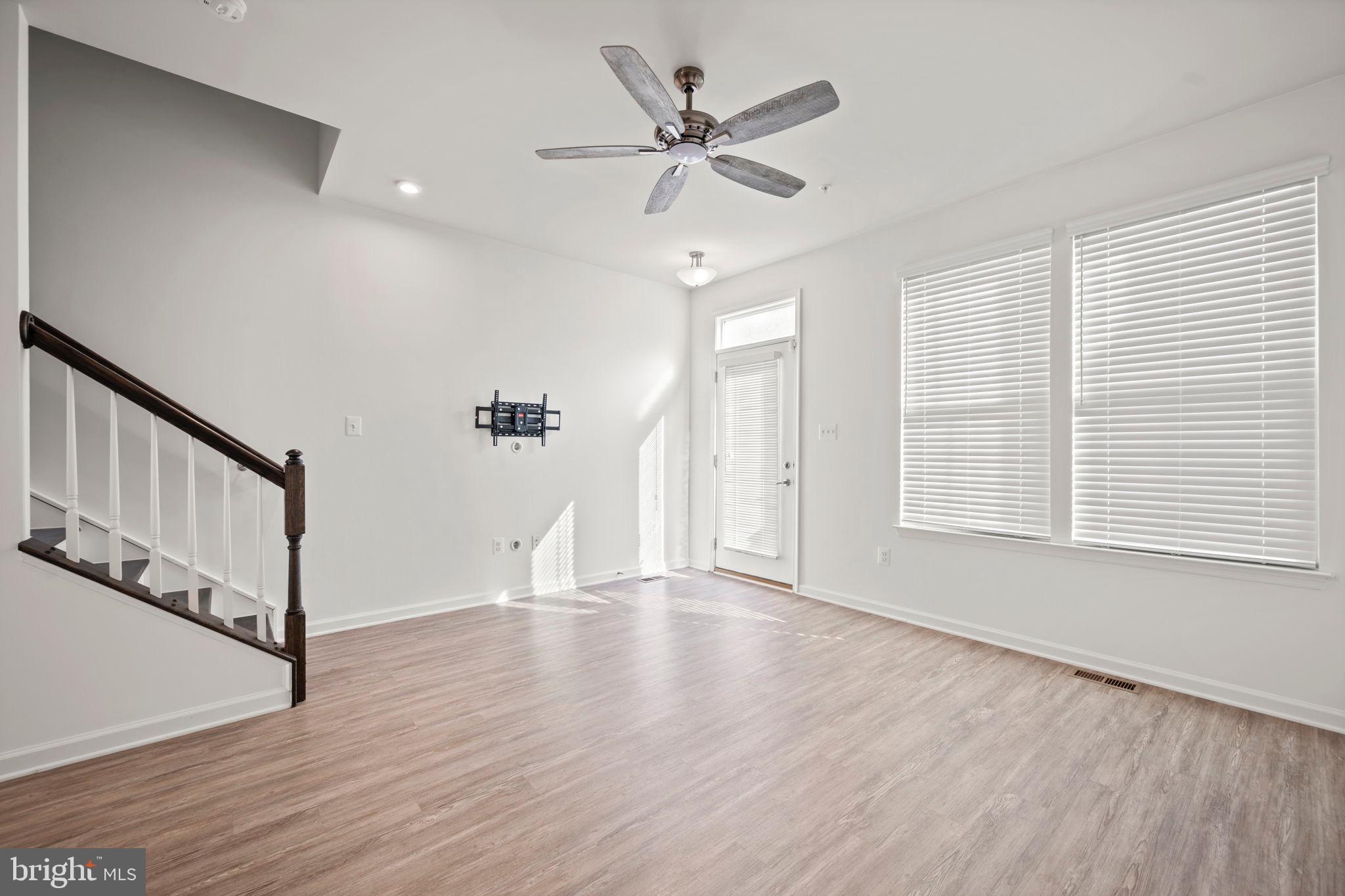 3769 Cedar Mountain Way Hanover, MD 21076 - Photo 4 of 52 wooden floor in an empty room with a window