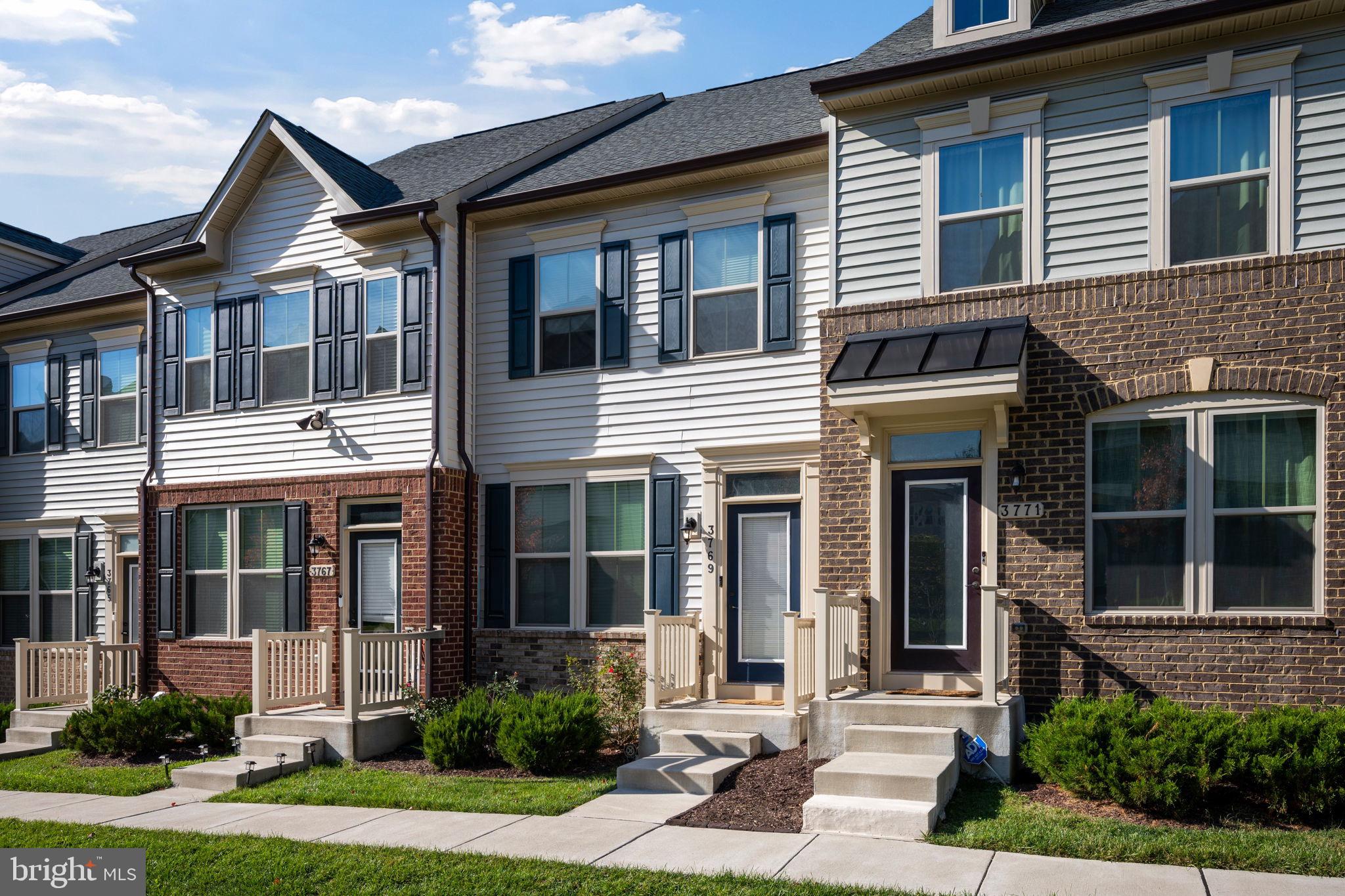 3769 Cedar Mountain Way Hanover, MD 21076 - Photo 47 of 52 a front view of a house with a yard