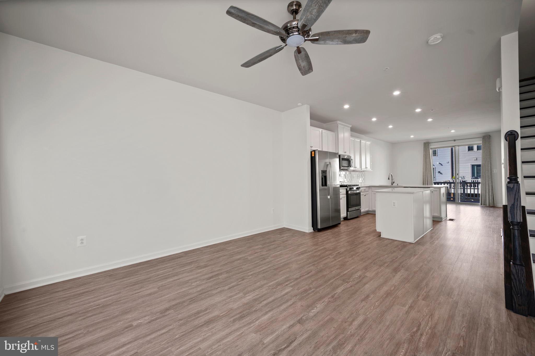 3769 Cedar Mountain Way Hanover, MD 21076 - Photo 52 of 52 a view of a kitchen with a sink and a refrigerator
