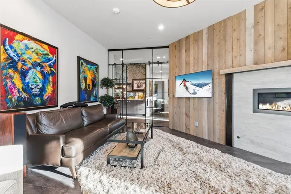 a bedroom with a bed and a large mirror
