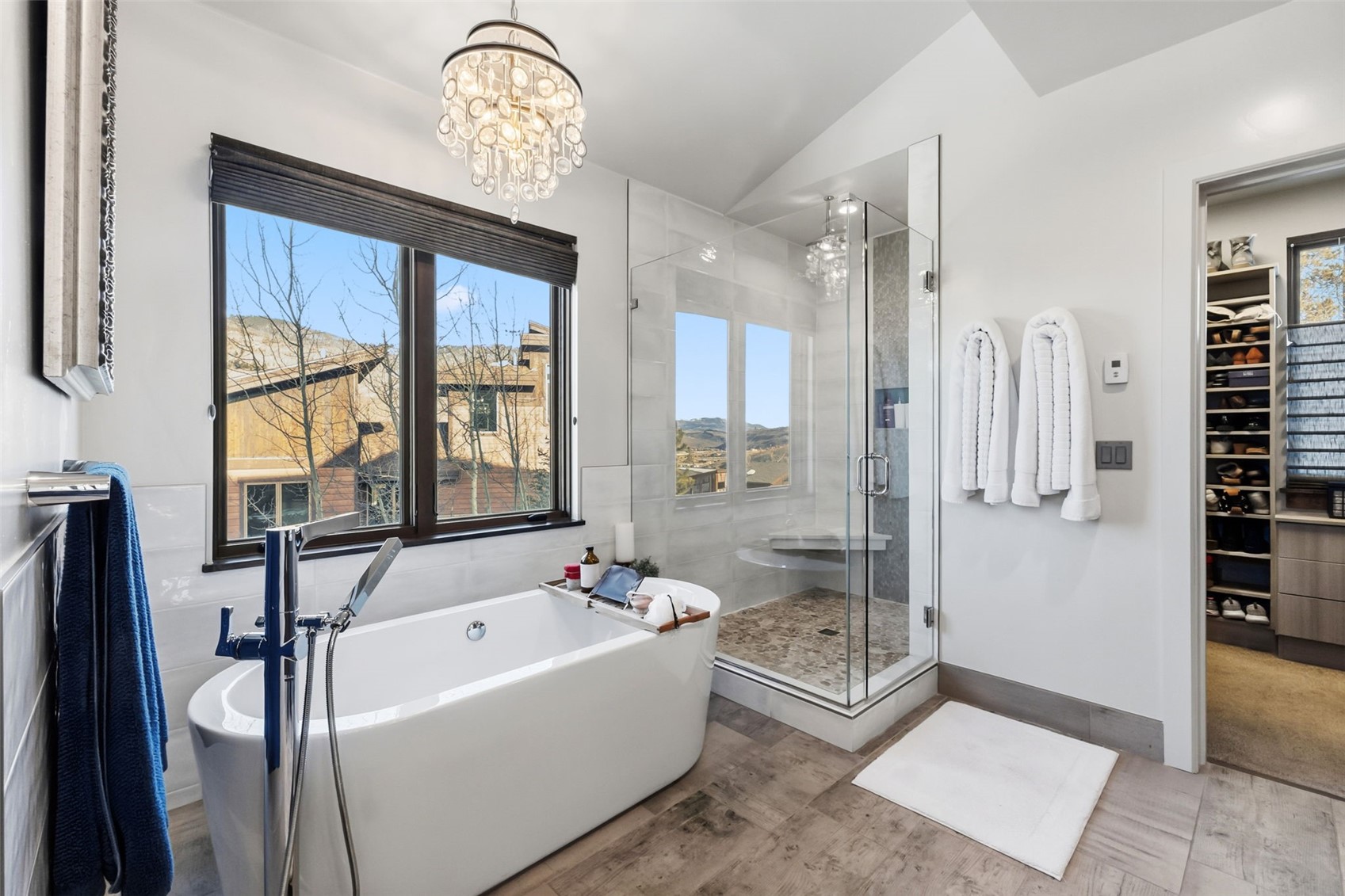 240 Game Trail Road Silverthorne, CO 80498 - Photo 27 of 49 a bathroom with a bathtub and a shower