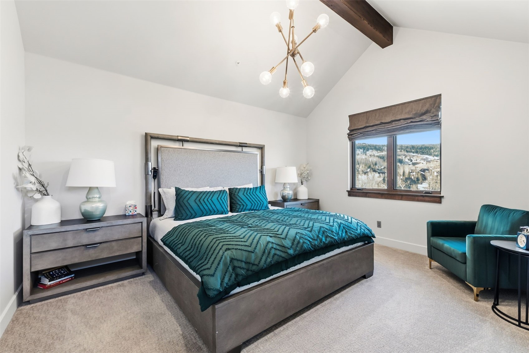 240 Game Trail Road Silverthorne, CO 80498 - Photo 30 of 49 a spacious bedroom with a bed and a couch