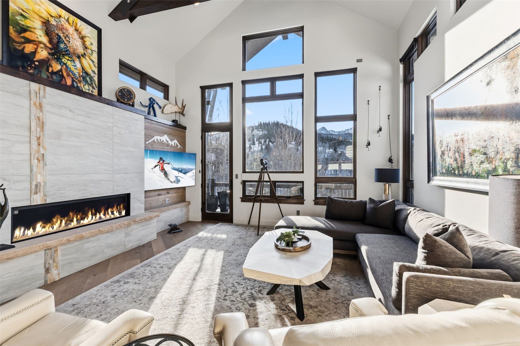 240 Game Trail Road Silverthorne, CO 80498 - Photo 4 of 49 a living room with furniture and a floor to ceiling window