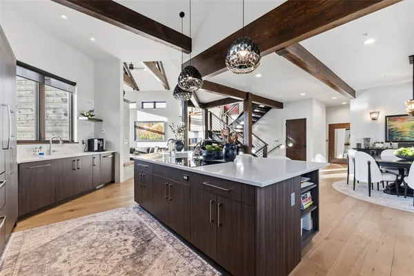 a kitchen with stainless steel appliances kitchen island granite countertop a sink and cabinets