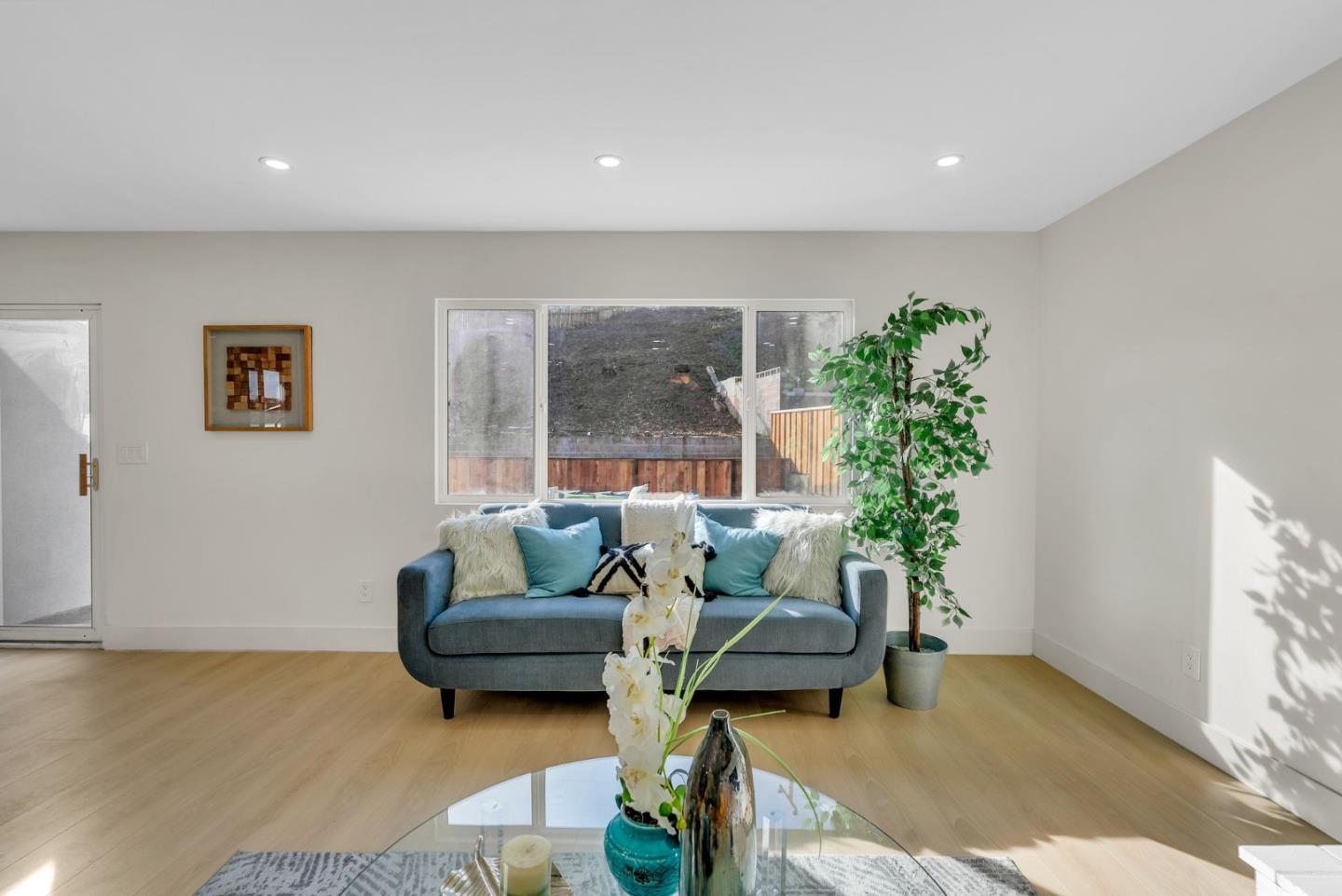 2011 Willow Way San Bruno, CA 94066 - Photo 12 of 57 a living room with furniture and a potted plant