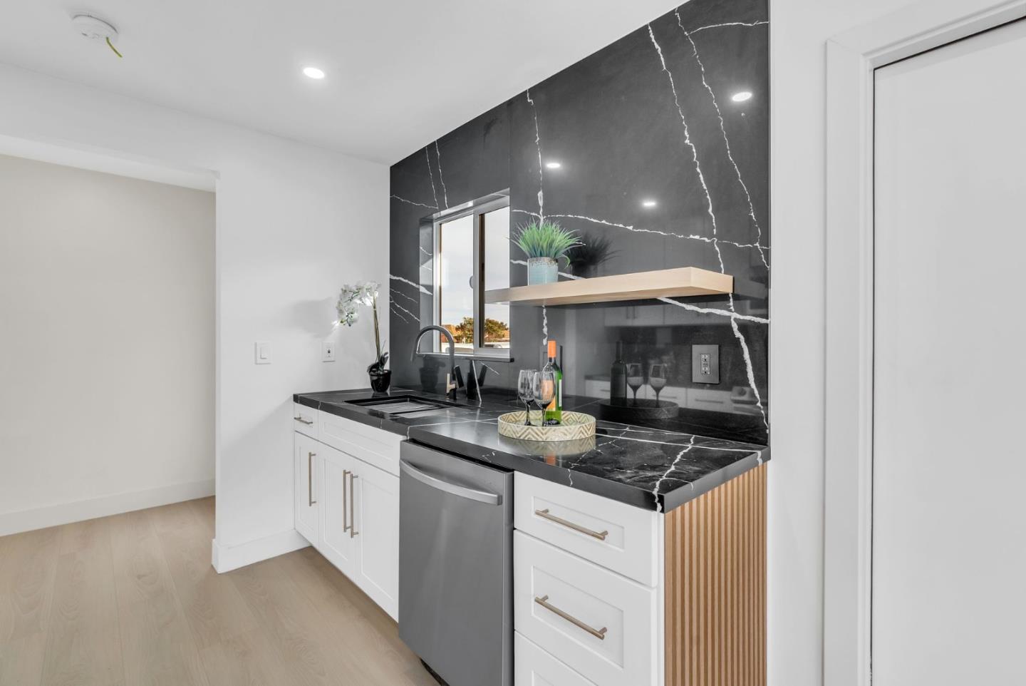 2011 Willow Way San Bruno, CA 94066 - Photo 15 of 57 a kitchen with a sink and cabinets