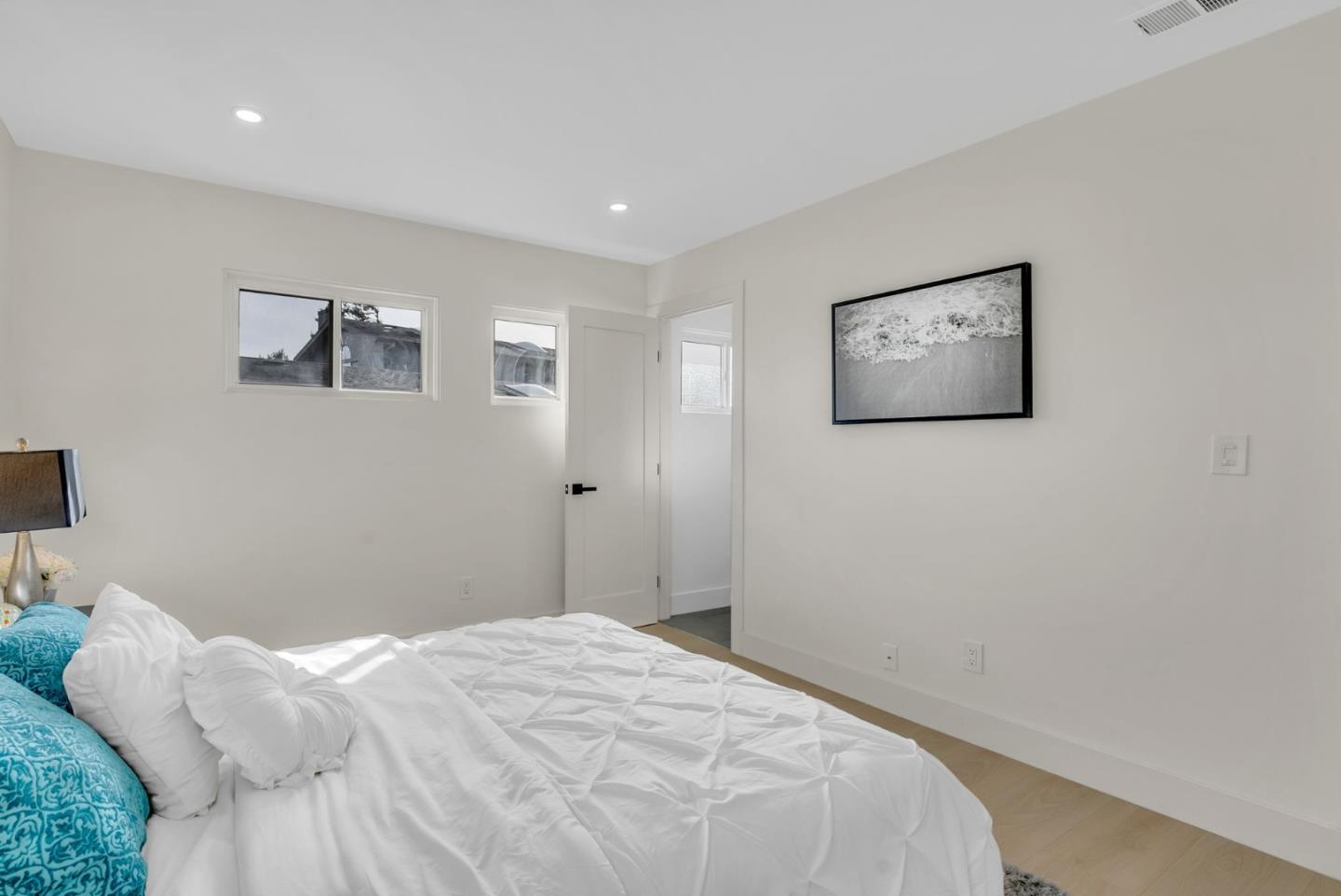 2011 Willow Way San Bruno, CA 94066 - Photo 30 of 57 a bedroom with a bed and a lamp