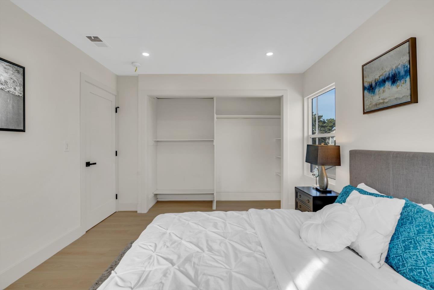 2011 Willow Way San Bruno, CA 94066 - Photo 31 of 57 a bedroom with a large bed and painting on the wall