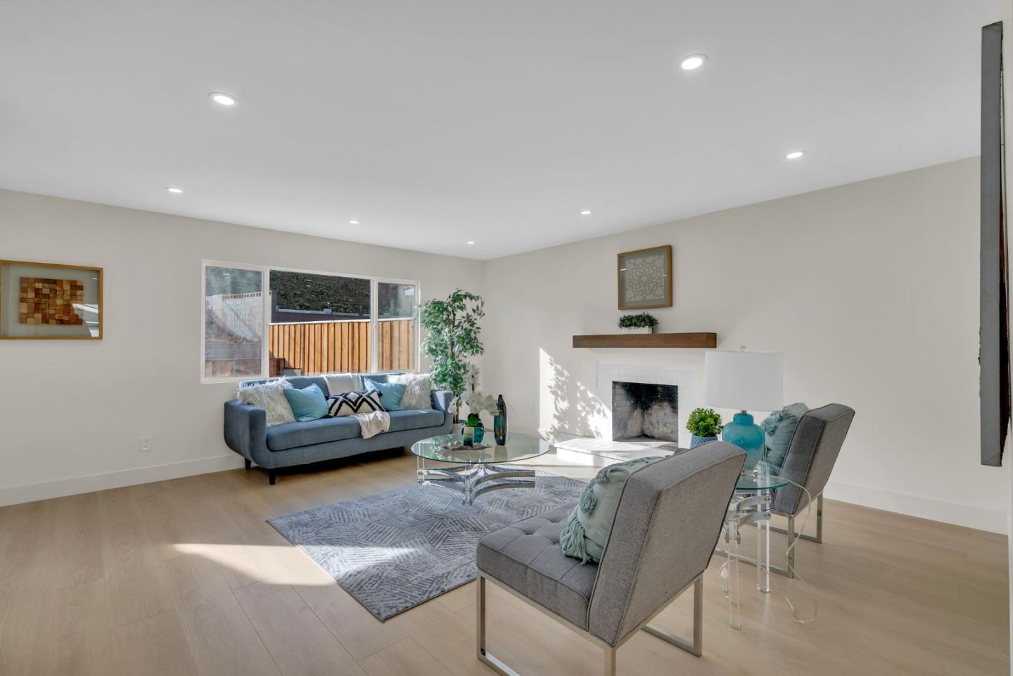 2011 Willow Way San Bruno, CA 94066 - Photo 7 of 57 a living room with furniture and a fireplace