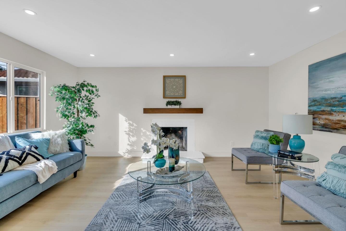 2011 Willow Way San Bruno, CA 94066 - Photo 8 of 57 a living room with furniture and a fireplace
