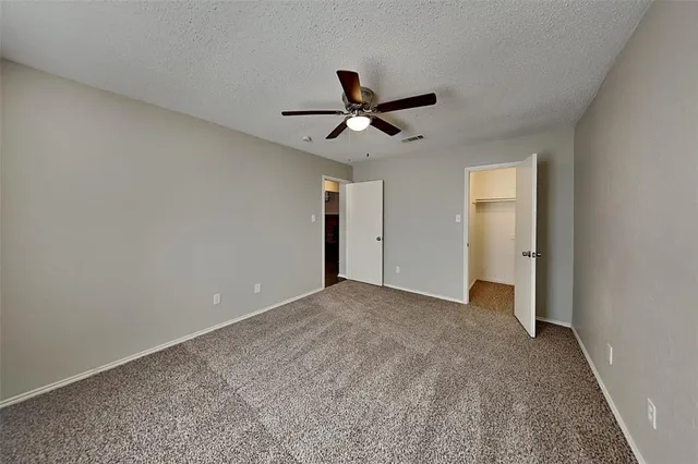 a view of a ceiling fan in a room