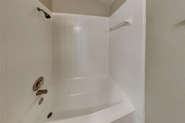 a close view of a bathtub in bathroom