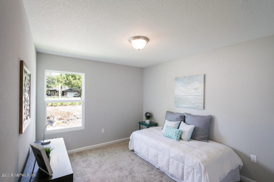 4114 Barnes Road South Jacksonville, FL 32207 - Photo 3 of 10 a bedroom with a bed and a window
