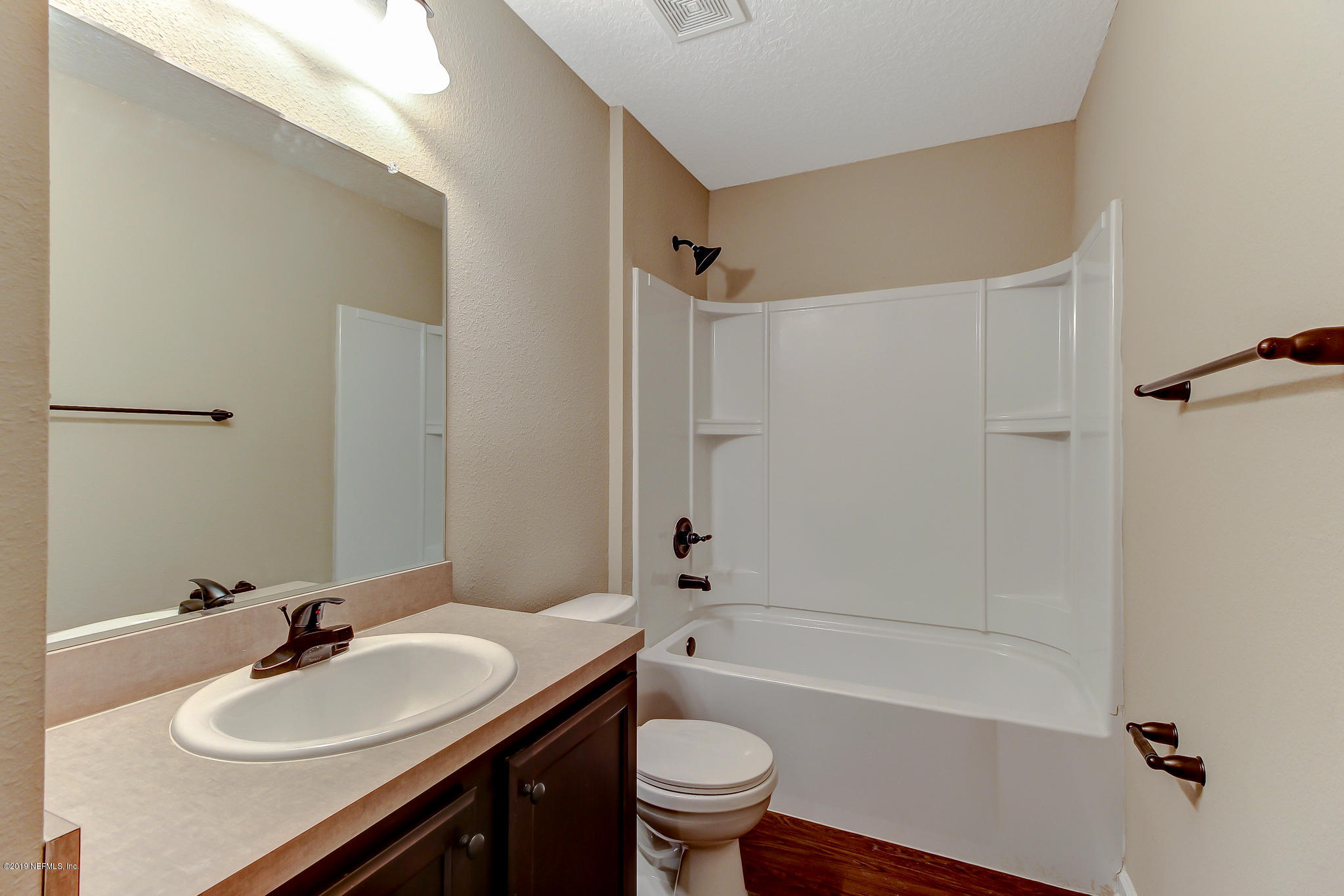 4114 Barnes Road South Jacksonville, FL 32207 - Photo 6 of 10 a bathroom with a sink a toilet and a bathtub