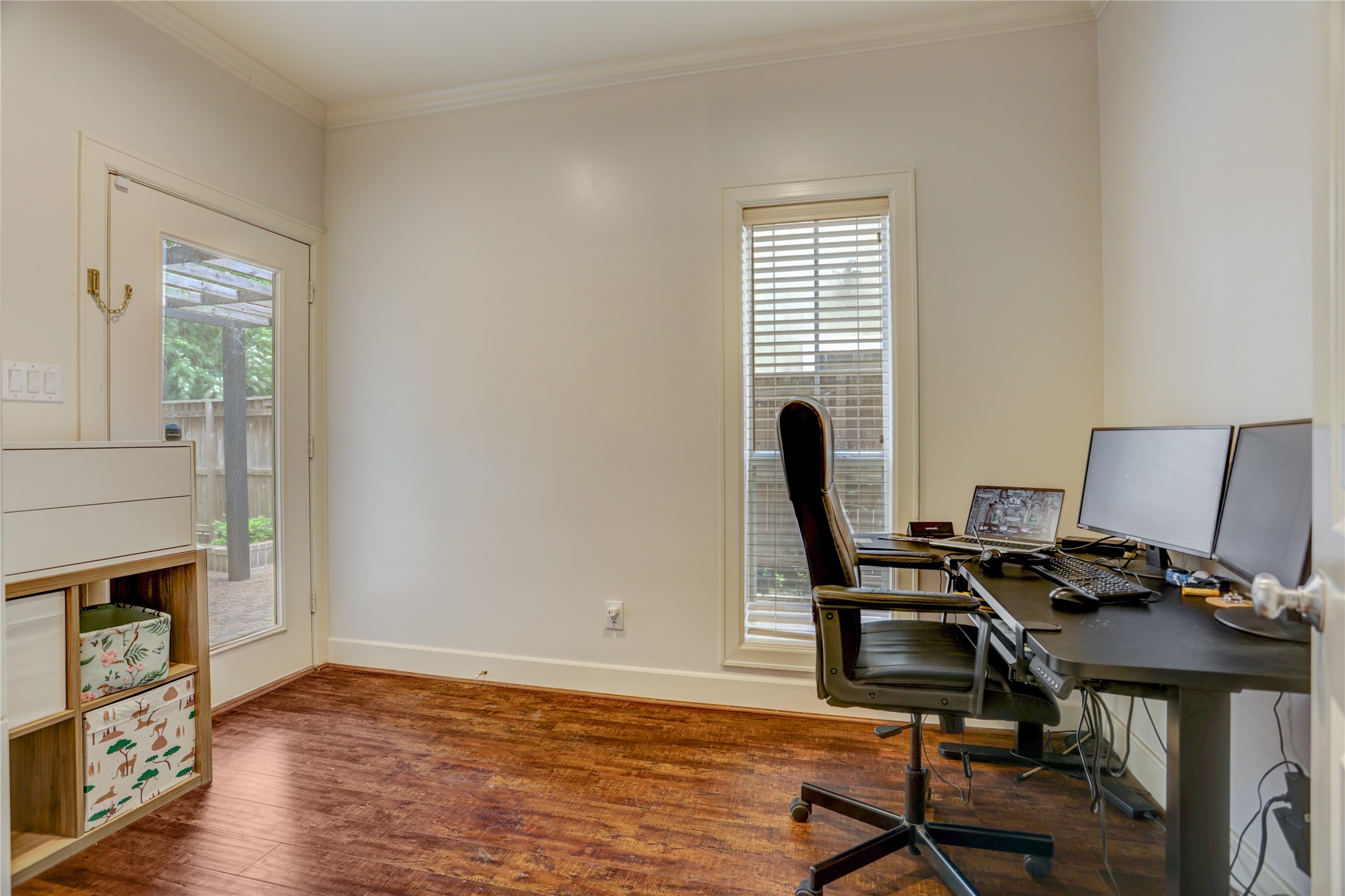 4262 Childress Street, Unit B Houston, TX 77005 - Photo 4 of 22 a view of a workspace with furniture and a window
