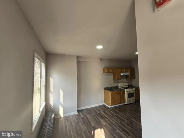 a view of kitchen and wooden floor