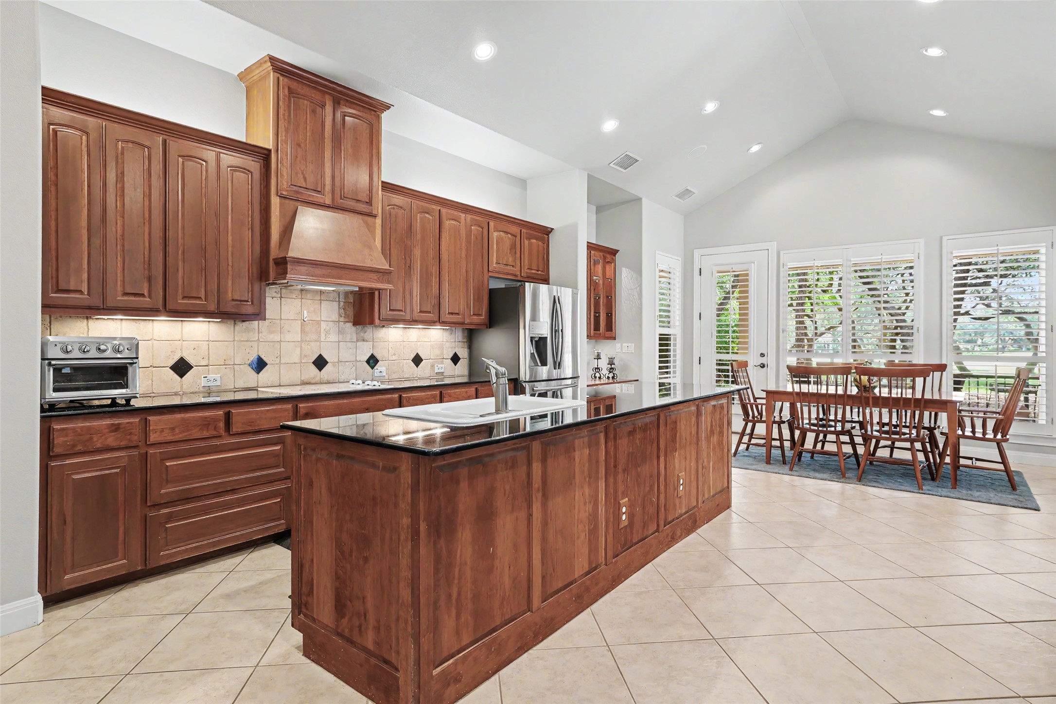 33 Meadows End Georgetown, TX 78628 - Photo 14 of 40 Culinary delights await in this bright kitchen with a spacious island and dining area.