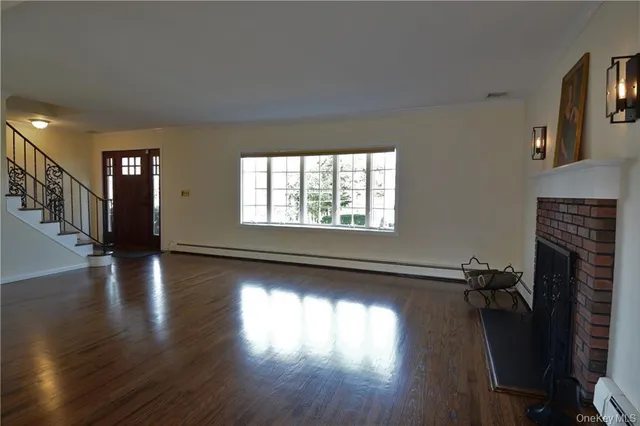 a view of livingroom with hardwood floor and a fireplace