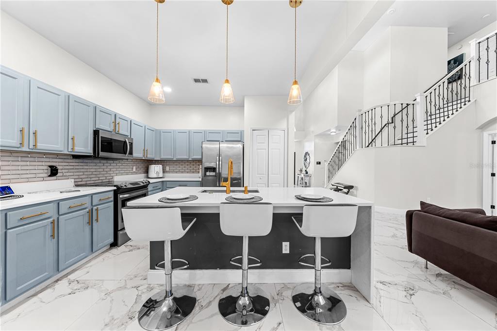 4301 Presidio Way Kissimmee, FL 34746 - Photo 12 of 50 a kitchen with a sink and stove