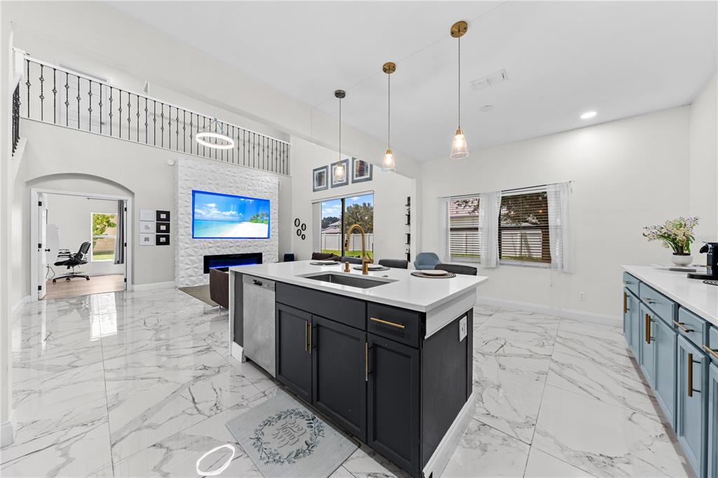 4301 Presidio Way Kissimmee, FL 34746 - Photo 17 of 50 a kitchen with sink stove and cabinets