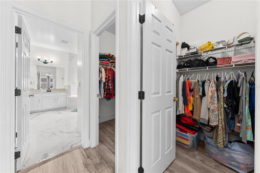 4301 Presidio Way Kissimmee, FL 34746 - Photo 25 of 50 a view of walk in closet with clothes and shoes