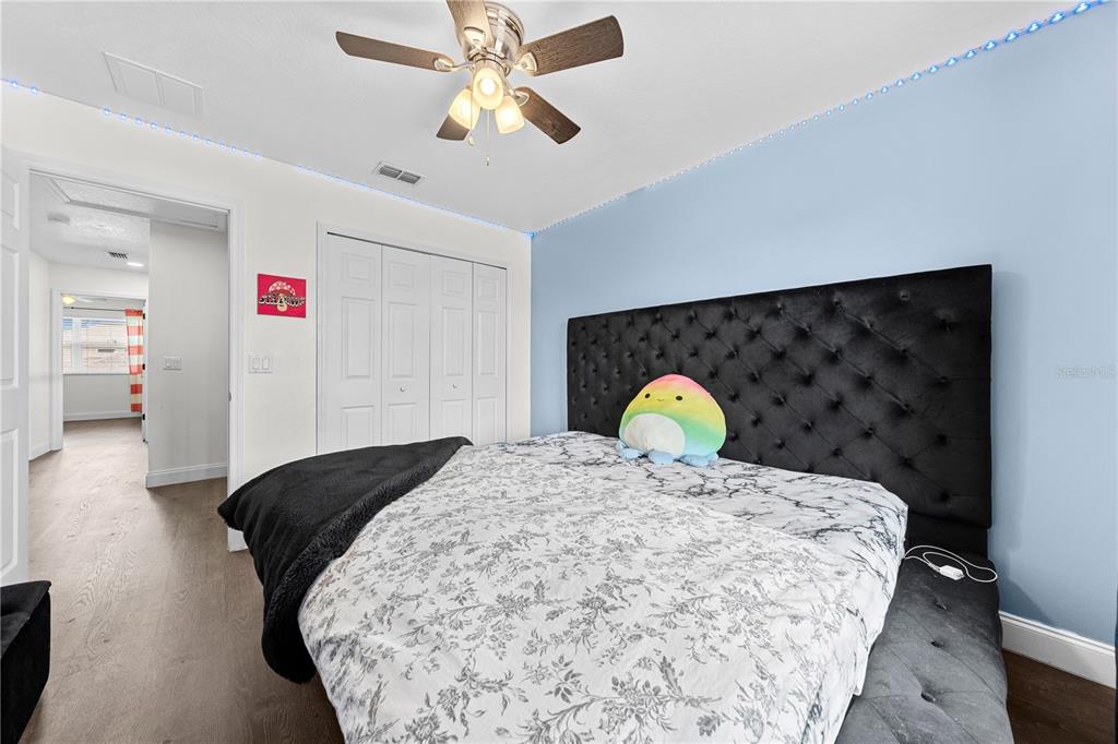 4301 Presidio Way Kissimmee, FL 34746 - Photo 28 of 50 a bedroom with a bed and dresser